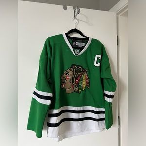 Chicago. Blackhawks Jonathan Toews Green Jersey. Size 48 (equates to Small)